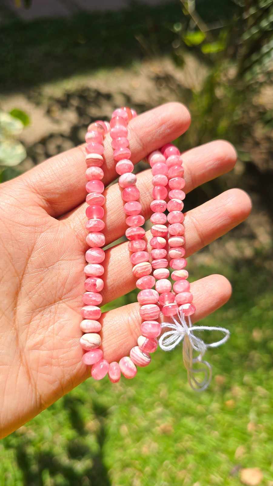 Rhodocrosites smooth rondelles with beautiful cream, marble like bands